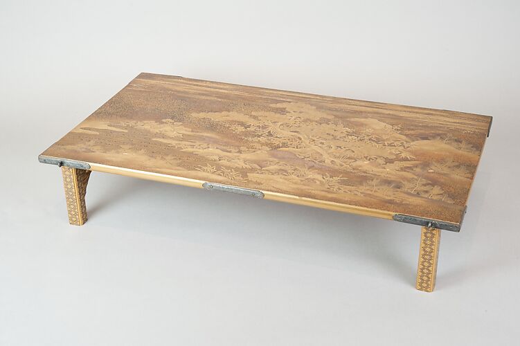 Table with Design of Pine and Plum Trees