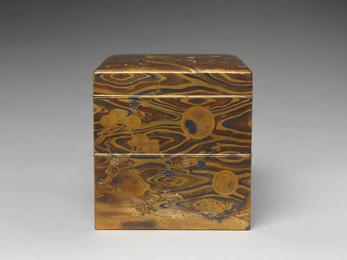 Cosmetic Box (mayudzukuri-bako) with Pine, Bamboo, Plum, and Tokugawa Family Crest on Wood-Grain Ground, Lacquered wood with gold, silver takamaki-e, hiramaki-e, togidashimaki-e, gold and silver foil application, gold and silver inlay on wood-grain lacquer ground, Japan