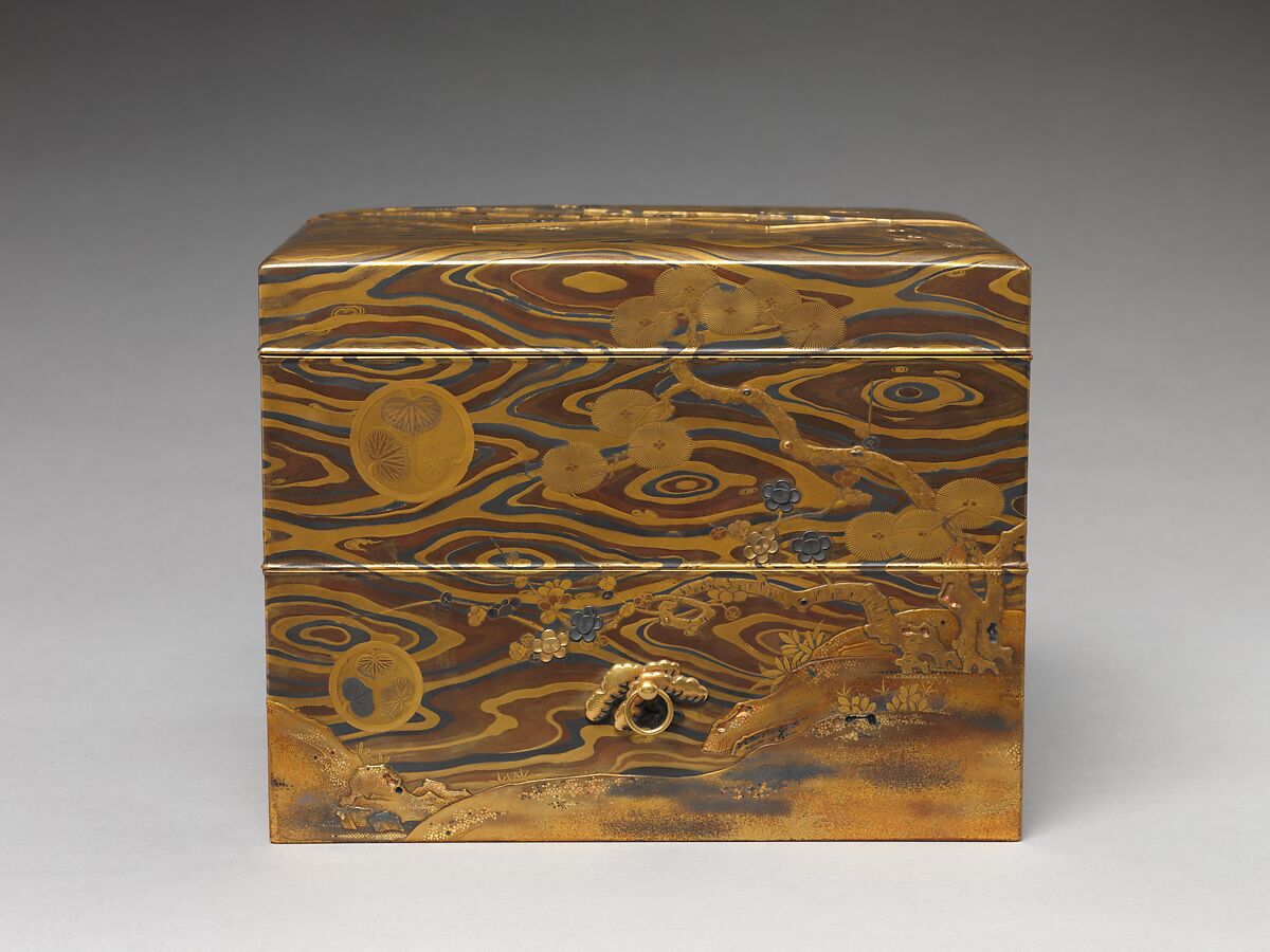 Cosmetic Box (mayudzukuri-bako) with Pine, Bamboo, Plum, and Tokugawa Family Crest on Wood-Grain Ground, Lacquered wood with gold, silver takamaki-e, hiramaki-e, togidashimaki-e, gold and silver foil application, gold and silver inlay on wood-grain lacquer ground, Japan