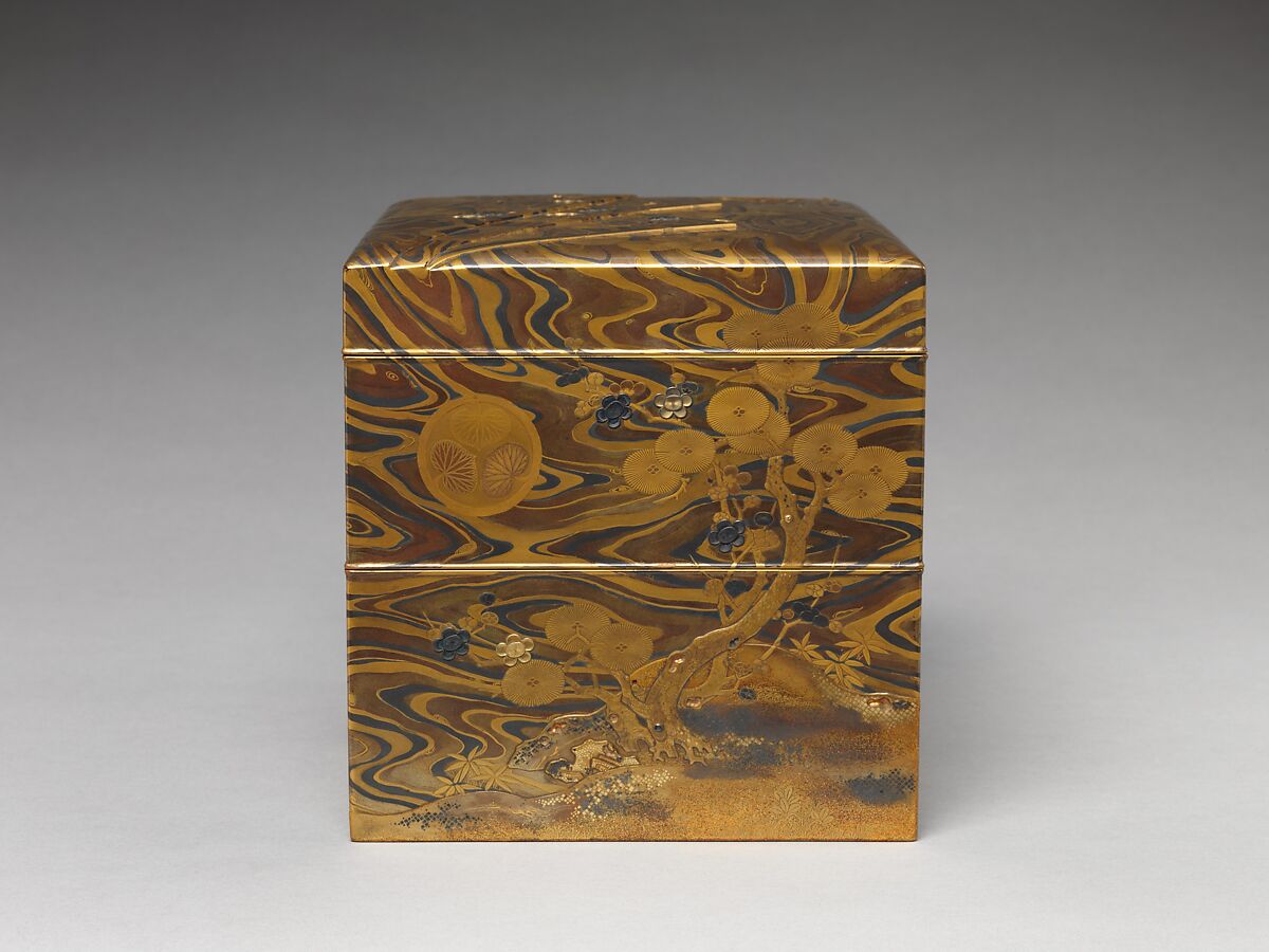 Cosmetic Box (mayudzukuri-bako) with Pine, Bamboo, Plum, and Tokugawa Family Crest on Wood-Grain Ground, Lacquered wood with gold, silver takamaki-e, hiramaki-e, togidashimaki-e, gold and silver foil application, gold and silver inlay on wood-grain lacquer ground, Japan