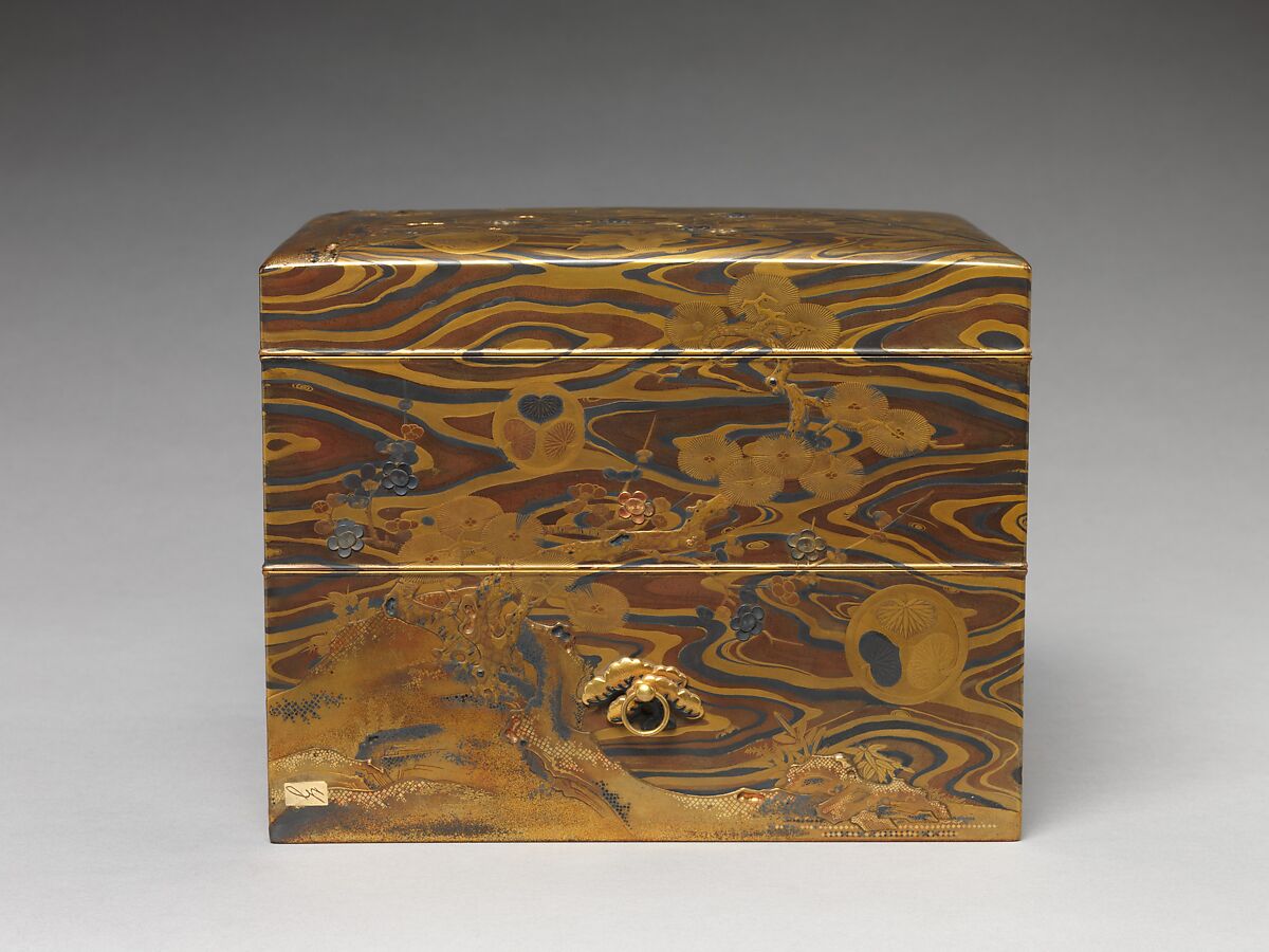 Cosmetic Box (mayudzukuri-bako) with Pine, Bamboo, Plum, and Tokugawa Family Crest on Wood-Grain Ground, Lacquered wood with gold, silver takamaki-e, hiramaki-e, togidashimaki-e, gold and silver foil application, gold and silver inlay on wood-grain lacquer ground, Japan
