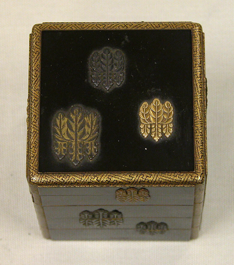 Box of Four Trays with Design of Paulownia Crest, Black lacquer with paulownia crest in applied gold, silver and copper, Japan