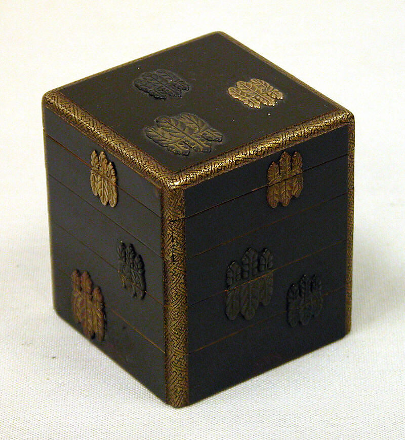 Box of Four Trays with Design of Paulownia Crest, Black lacquer with paulownia crest in applied gold, silver and copper, Japan 