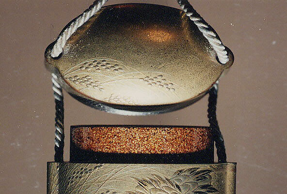 Inrō with Cranes in Rice Fields, Gold lacquer ground with gold and silver hiramaki-e and takamaki-e, red lacquer, and kirikane (cut-out foil)Ojime: bead; coralNetsuke: box with shells and seaweed; maki-e lacquer with gold and abalone-shell inlay, Japan