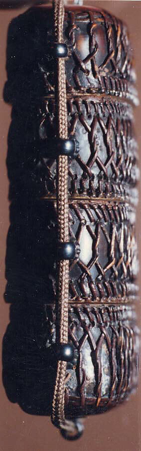 Tortoiseshell and Basketry Inrō, Three cases; tortoiseshell under plaited bamboo or rattan covered with lacquer (urushi) Netsuke: manju type, imitating basketry; stained ivory Ojime: flower; bronze, Japan