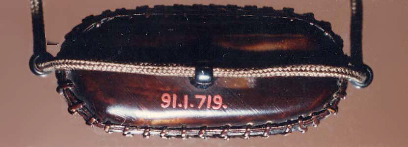 Tortoiseshell and Basketry Inrō, Three cases; tortoiseshell under plaited bamboo or rattan covered with lacquer (urushi) Netsuke: manju type, imitating basketry; stained ivory Ojime: flower; bronze, Japan