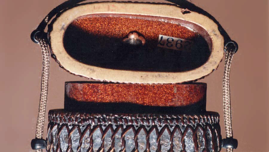 Tortoiseshell and Basketry Inrō, Three cases; tortoiseshell under plaited bamboo or rattan covered with lacquer (urushi) Netsuke: manju type, imitating basketry; stained ivory Ojime: flower; bronze, Japan