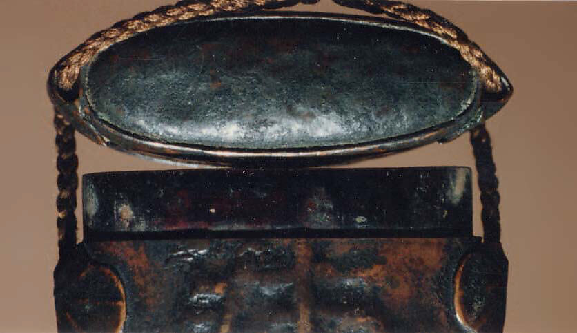 Case (Inrō) with Design of a Stylized Archaic Character in Relief, Lacquer, copper metal with dark patina, embossed relief, applied cord runners; Interior: black lacquer and metal, Japan