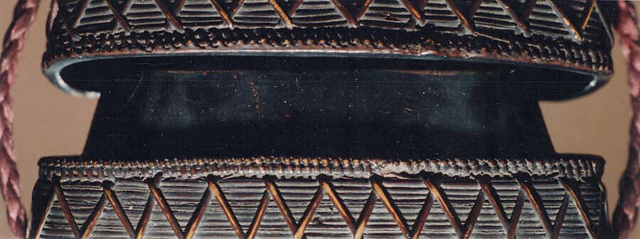 Basketry Inrō, Single case; plaited bamboo and rattan covered with lacquer (urushi) Netsuke: masks; wood, Japan