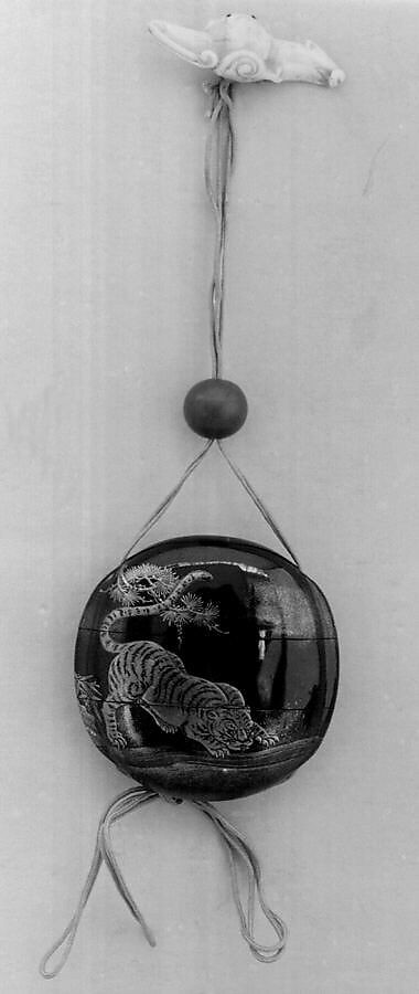 Inrō with Tiger Drinking from a River beside Rocks and Pine Tree, Two cases; lacquered wood with gold and silver togidashimaki-e, hiramaki-e, takamaki-e, cut-out gold foil application on black groundNetsuke: bat; carved walrus ivoryOjime: coral bead, Japan