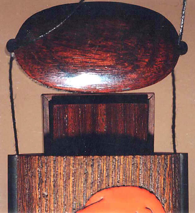 Case (Inrō) with Portrait of Daruma (obverse); Large Lotus Leaf and Stalk with Seed Pod (reverse), Brown wood, gold, brown and red hiramakie, pewter inlay, inlaid eyes; Interior: plain, covered box, Japan