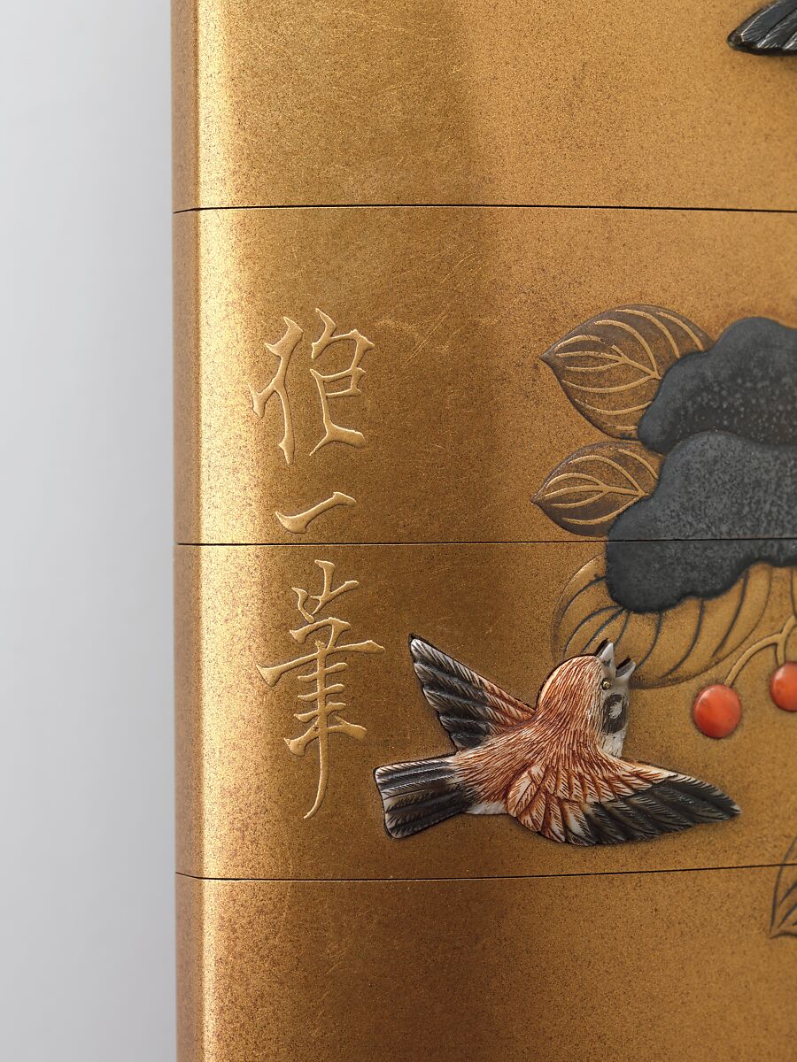 Inrō with Sparrows in Snow-covered Nandina, Hara Yōyūsai (Japanese, 1772–1845), Lacquer with gold and silver makie, coral, and applied stained ivory
Ojime: bead with stylized medallions; green stone with gold makie lacquer 
Netsuke: round box with iris design, Japan