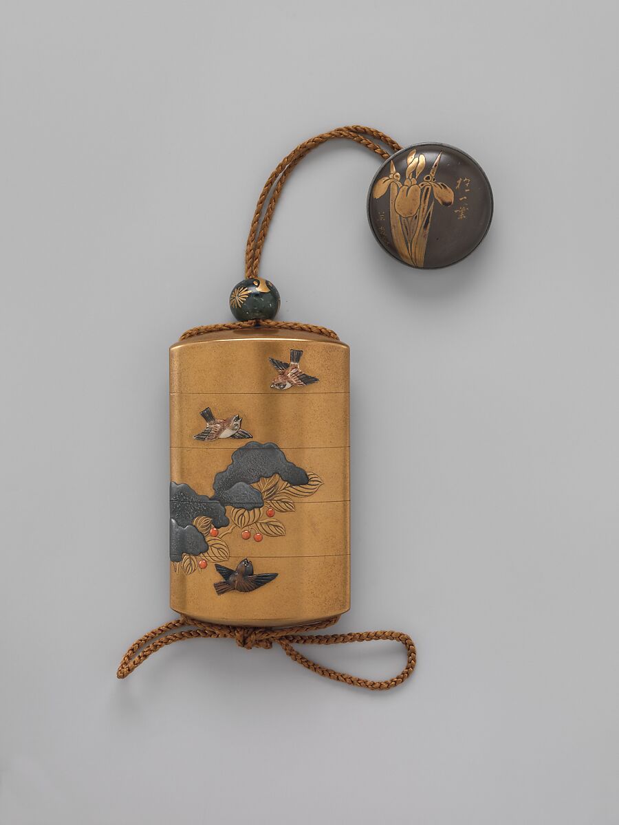 Inrō with Sparrows in Snow-covered Nandina, Hara Yōyūsai (Japanese, 1772–1845), Lacquer with gold and silver makie, coral, and applied stained ivory
Ojime: bead with stylized medallions; green stone with gold makie lacquer 
Netsuke: round box with iris design, Japan 