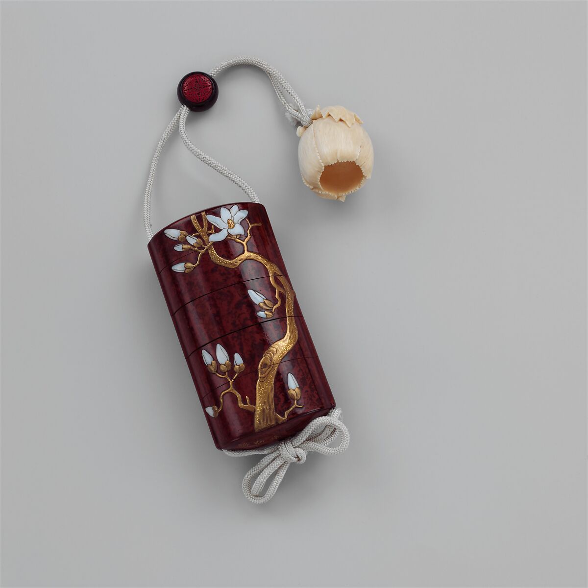 Inrō with Cockatoo and Magnolia, Yamada Jōkasai (Japanese, 1811–1879), Red lacquer ground with gold maki-e, carved red lacquer, and mother-of-pearl inlayNetsuke: poppy; ivoryOjime: roundels; red and green lacquer in wood, Japan