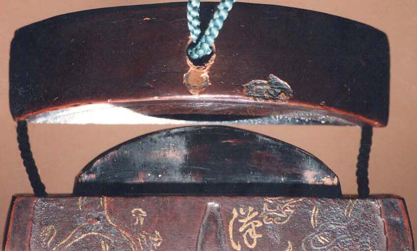 Case (Inrō) with Design of Hannya and Anchin-san beside Maple Leaves (obverse); Flaming Dragons and Inscription (reverse), Lacquer, dark brown ground imitating iron, gold, black, red and silver hiramakie; Interior: roiro and fundame, Japan