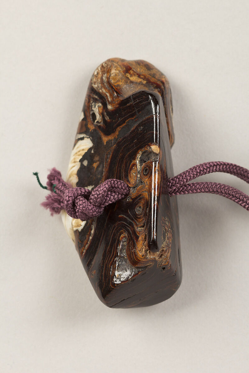 Inrō with the Noh Play Ebira (Quiver), Three cases; lacquered wood with gold, silver, color takamaki-e, hiramaki-e on red ground
Netsuke: fossilized wood
Ojime: carved red lacquer bead, Japan