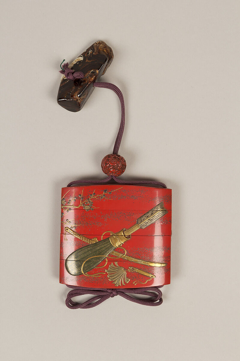 Inrō with the Noh Play Ebira (Quiver), Three cases; lacquered wood with gold, silver, color takamaki-e, hiramaki-e on red ground
Netsuke: fossilized wood
Ojime: carved red lacquer bead, Japan