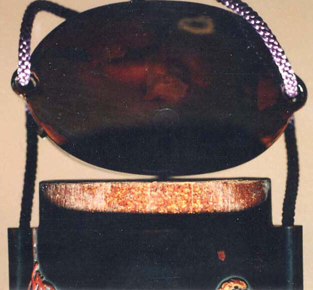 Case (Inrō) with Design of Bugaku Dance Hat on Stand beside Pine Tree (obverse); Dance Drum (reverse), Lacquer, roiro, gold, red and brown takamakie, incised, ceramic inlay; Interior: nashiji and fundame, Japan