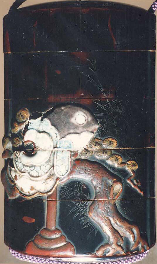 Case (Inrō) with Design of Bugaku Dance Hat on Stand beside Pine Tree (obverse); Dance Drum (reverse), Lacquer, roiro, gold, red and brown takamakie, incised, ceramic inlay; Interior: nashiji and fundame, Japan