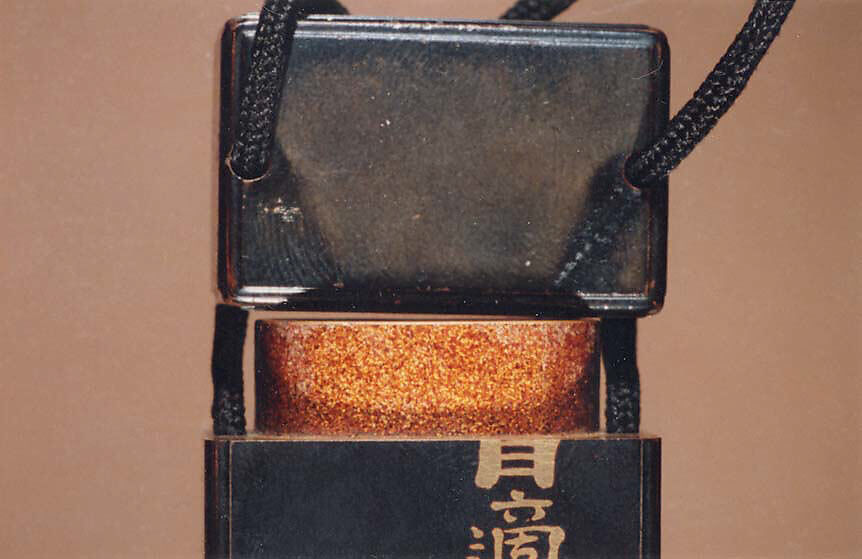 Inrō with Two Standing Horses; Seal and Inscription (reverse), After Kano Naonobu (Japanese, 1607–1650), Four cases; lacquered wood with gold hiramaki-e, gold foil application, and mother-of-pearl inlay on black groundNetsuke: horse; ivory Ojime: iron bead with cricket and flower in gold overlay, Japan