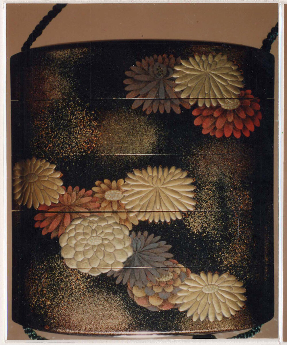 Inrō with Scattered Chrysanthemums, Four cases; lacquered wood with gold, silver hiramaki-e, togidashimaki-e, red lacquer, muranashiji on black lacquer ground; Netsuke: ivory and metal, kagamibuta type; crossing boat; Ojime: metal bead, Japan