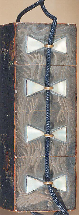 Case (Inrō) in the Shape of Wood Seal with Decoration of Pheonix and Paulownia Tree, Lacquer with red, black green, brown, and white painted lacquer 
on gray ground
Ojime: kingfisher on lotus stem; wood, stained ivory and mother-of-pearl inlay
Netsuke: yamabushi and wood gatherers, Japan