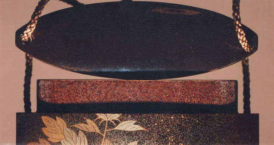 Inrō with Flowering Peonies, Four cases; lacquered wood with gold, silver, red togidashimaki-e on black lacquer ground; Netsuke: carved ivory; sage with a handscroll; Ojime: carved red lacquer bead, Japan