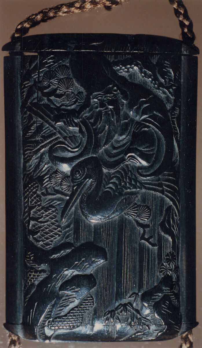 Case (Inrō) with Design of Fukurokuju (God of Longevity) Riding a  Flying Crane before Waterfall (obverse); Kinko Sennin Riding a Carp on Waves (reverse), Wood, ebony, carved relief; Interior: plain, boxes, Japan