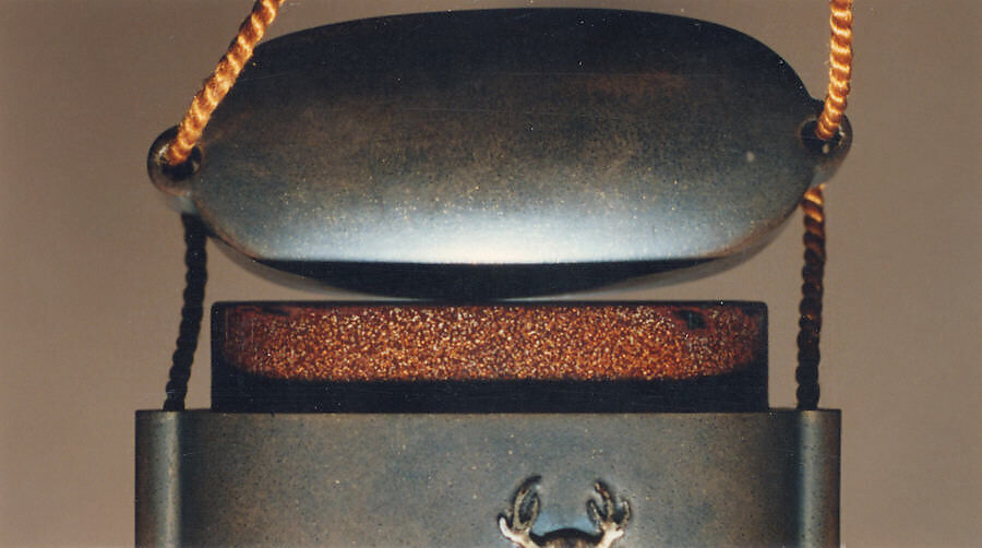Case (Inrō) with Design of Spring Fern and Horsetail (obverse); Deer (reverse), Ogawa Haritsu (Ritsuō) (Japanese, 1663–1747), Ceramic, mother-of-pearl, pewter on brown lacquer with sprinkled gold
Ojime: bead; agate
Netsuke: ivory and wood, Japan