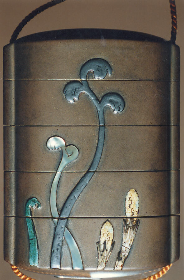 Case (Inrō) with Design of Spring Fern and Horsetail (obverse); Deer (reverse), Ogawa Haritsu (Ritsuō) (Japanese, 1663–1747), Ceramic, mother-of-pearl, pewter on brown lacquer with sprinkled gold
Ojime: bead; agate
Netsuke: ivory and wood, Japan