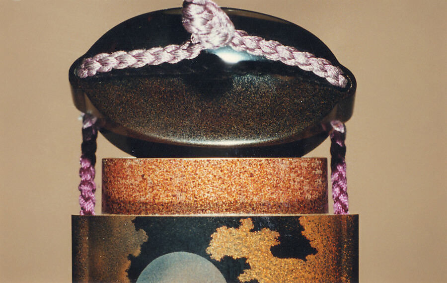 Case (Inrō) with Design of Heron Standing on One Leg (obverse); Full Moon among Clouds (reverse), Silver, gold, color togidashi/maki-e on black ground; 
Interior: nashiji and fundame, Japan