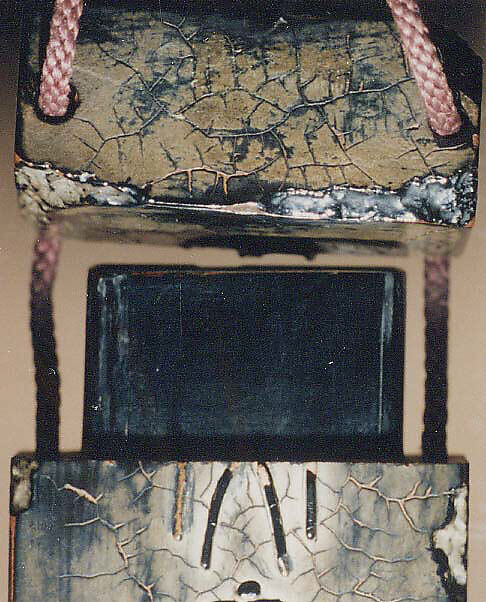 Inrō Imitating an Old Chinese Ink Cake, Kanō Jukkyoku (Japanese), Four cases; lacquered wood with black and brown takamaki-e, togidashimaki-eNetsuke: carved red lacquer with chrysanthemum designOjime: carved nut, Japan