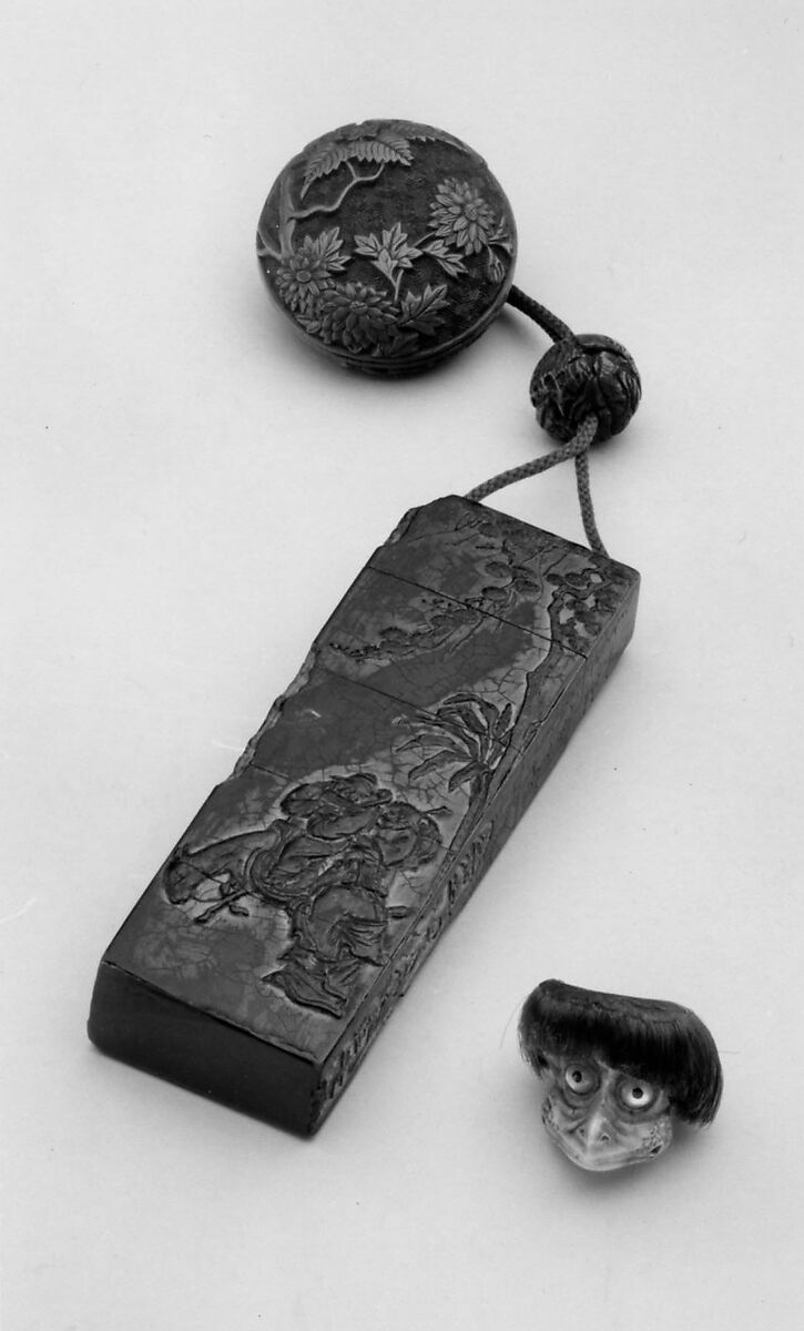Inrō Imitating an Old Chinese Ink Cake, Kanō Jukkyoku (Japanese), Four cases; lacquered wood with black and brown takamaki-e, togidashimaki-eNetsuke: carved red lacquer with chrysanthemum designOjime: carved nut, Japan