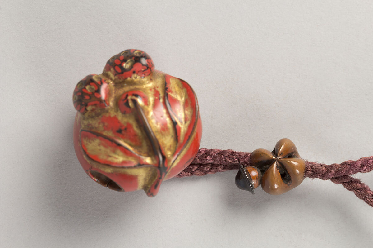 Case (Inrō) with Design of Daruma (obverse);  Fly Whisk (Hossu) (reverse), Lacquer, tan, brown ground, gold, black and red togidashi; Interior: nashiji and fundame, Japan