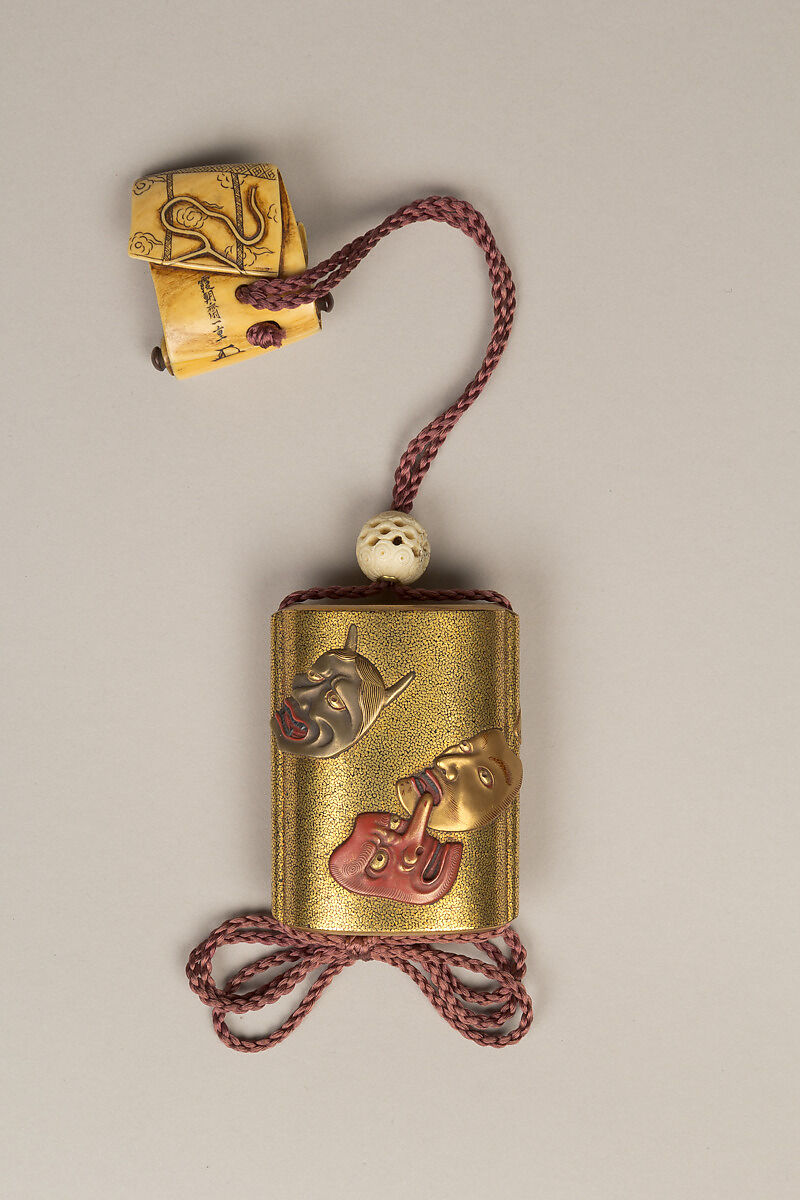 Inrō with Noh Masks, Two-part sheath type; lacquered wood with gold, silver, color takamaki-e, hiramaki-e, and carved lacquer and ceramic inlay on hirameji ground 
Netsuke: Shōki the Demon Queller; ivory
Ojime: openwork ivory bead, Japan