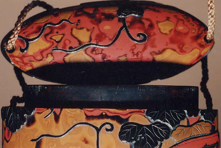 Case (Inrō) with Design of Praying Mantis beside Broken Wheel Overgrown with Vines, Lacquer, wakasa nuri, yellow, red marbled ground, black, grey and brown lacquer; Interior: roiro, Japan
