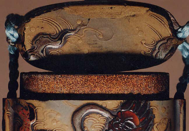 Case (Inrō) with Design of Bishamon on Clouds Pursuing Demon (Oni) Holding Sacred Gem, Lacquer, roiro and rubbed fundame, gold and silver hiramakie, tortoiseshell; Interior: nashiji and fundame, Japan