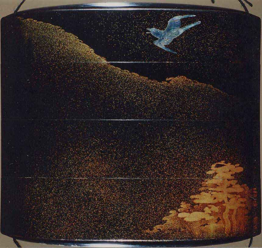 Case (Inrō) with Design of Flying Cuckoo in Flight above Pines (obverse); Bonito (Fish) on Bamboo Leaves (reverse), Toyōsai (1772–1845), Black lacquer with sprinkled gold and silver makie and mother-of-pearl
Ojime: bead with openwork design of waves; silver
Netsuke: fish laid on bamboo branch; stained ivory, Japan