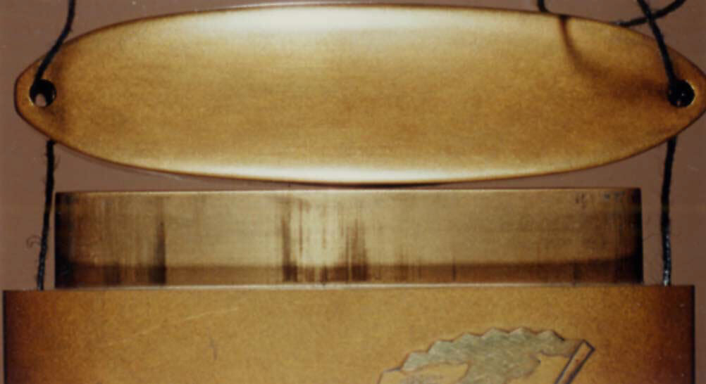 Case (Inrō) with Design of Noh Mask with Red Sun above Pine Trees (obverse); Props for a Noh Play (reverse), Lacquer, fundame, gold, silver, black and red hiramakie, gold and silver foil; Interior: red lacquer and fundame, Japan