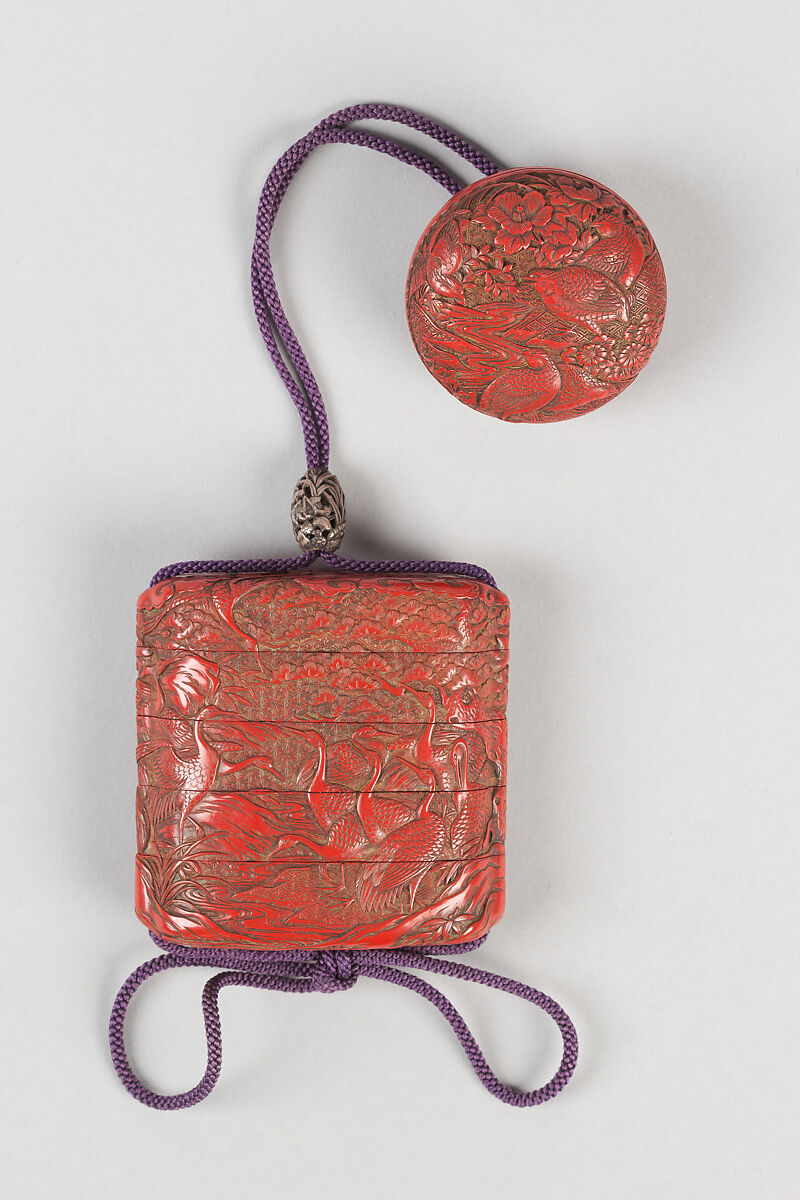 Inrō with Cranes in Plum, Bamboo and Pine, Carved red lacquerNetsuke: bird and flower; lacquer, tsuishuOjime: cricket among flowers; pierced and carved silver bead, Japan 