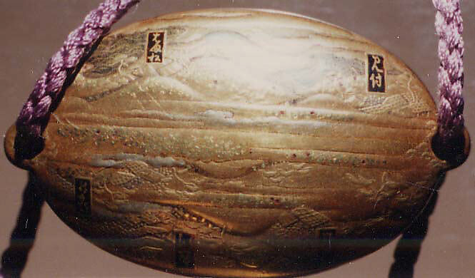 Inrō with the “Fifty-three Stations of the Tōkaidō”, Five cases; lacquered wood with gold and silver takamaki-e, hiramaki-e, togidashimaki-e, cut-out gold foil on gold and nashiji groundNetsuke: carved wood; Kintarō beating a TenguOjime: gold bead with stag in relief , Japan