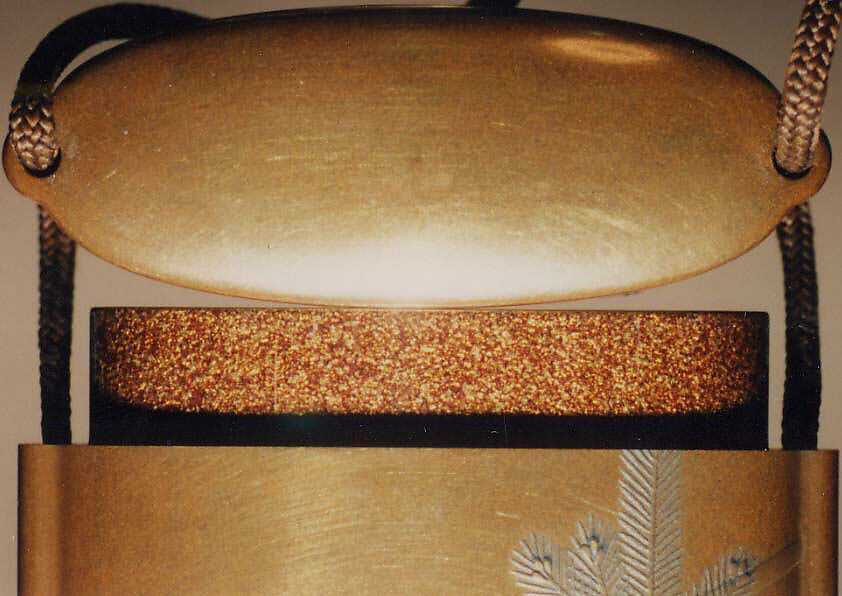 Case (Inrō) with Design of Actor's Masks, Robe and Fan beside Tasseled Box (obverse); Young Pine Trees beside Stage (reverse), Lacquer, kinji, gold, silver, black and red hiramakie, takamakie; Interior: nashiji and fundame, Japan