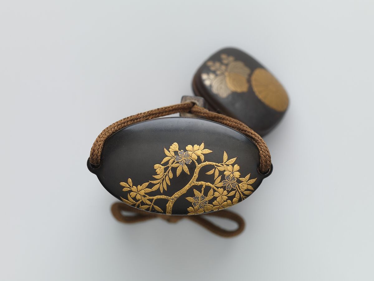 Inrō with Basket of Spring Flowers (obverse); Basket of Autumn Flowers (reverse), Five cases; lacquered wood with gold and silver hiramaki-e, togidashimaki-e, cutout gold foil application on black and nashiji lacquer groundNetsuke: lacquered wood with hiramaki-e; chrysanthemum and paulownia flowerOjime: silver bead inlaid with gold, Japan