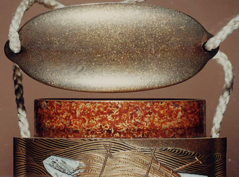 Case (Inrō) with Design of Sheaves of Rice in Boats, Koma School (Japanese), Gold maki-e with mother-of-pearl inlay and black lacquer 
Ojime: ivory 
Netsuke: carved bone with moon and goose, Japan