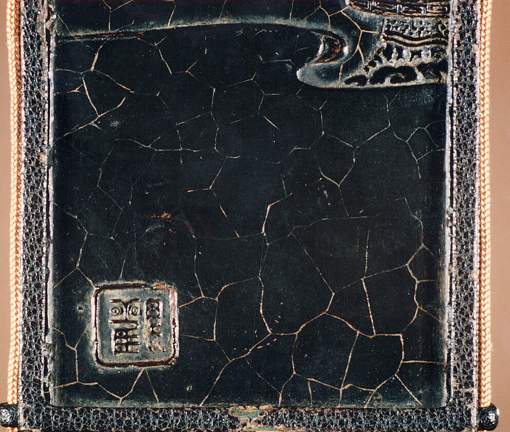 Inrō Imitating an Old Chinese Ink Cake, Ogawa Haritsu (Ritsuō) (Japanese, 1663–1747), Two-part (sheath-type); lacquered wood, metal, leather, with black and brown togidashimaki-e, takamaki-e on black groundNetsuke: manjū type with maki-e DarumaOjime: ceramic bead with incense and ash design , Japan