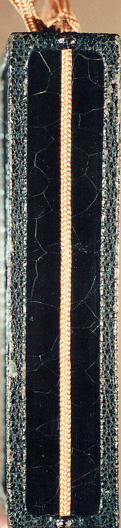 Inrō Imitating an Old Chinese Ink Cake, Ogawa Haritsu (Ritsuō) (Japanese, 1663–1747), Two-part (sheath-type); lacquered wood, metal, leather, with black and brown togidashimaki-e, takamaki-e on black groundNetsuke: manjū type with maki-e DarumaOjime: ceramic bead with incense and ash design , Japan