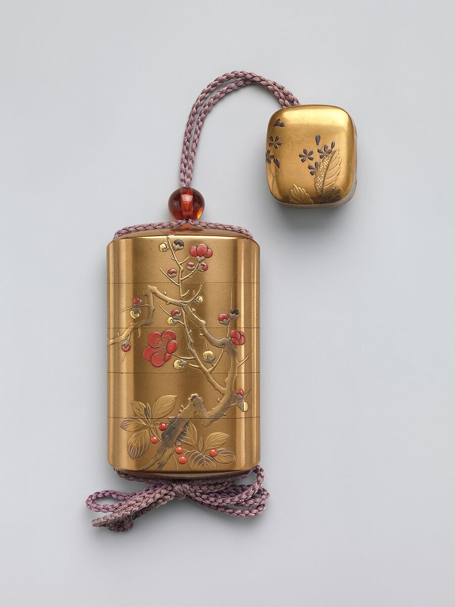 Inrō with Design of Blossoming Plum Tree, Hara Yōyūsai (Japanese, 1772–1845), Sprinkled gold lacquer with gold, silver, and red makie, takamakie, and coral inlay
Ojime: bead; tortoiseshell  
Netsuke: box with decoration of violets; gold makie lacquer with gold and silver makie, Japan 