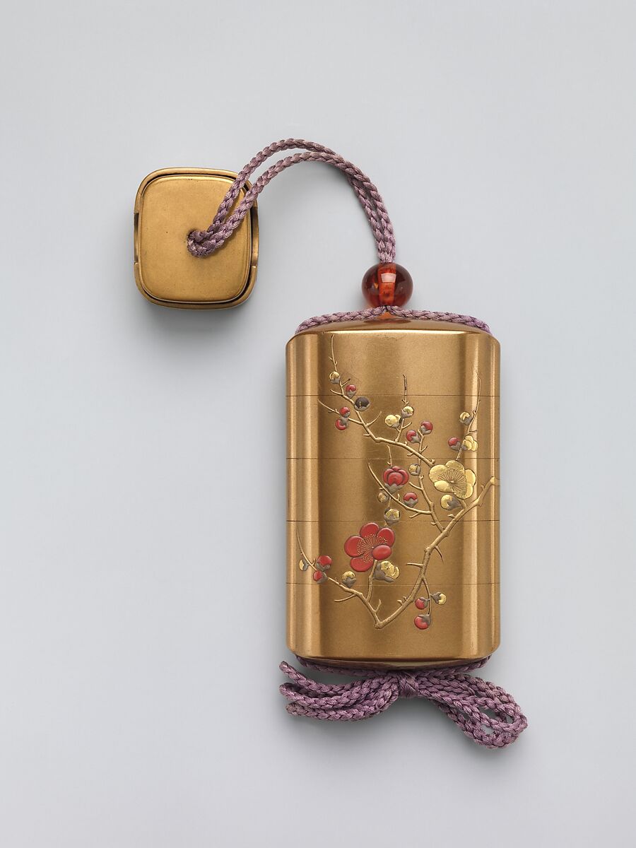 Inrō with Design of Blossoming Plum Tree, Hara Yōyūsai (Japanese, 1772–1845), Sprinkled gold lacquer with gold, silver, and red makie, takamakie, and coral inlay
Ojime: bead; tortoiseshell  
Netsuke: box with decoration of violets; gold makie lacquer with gold and silver makie, Japan