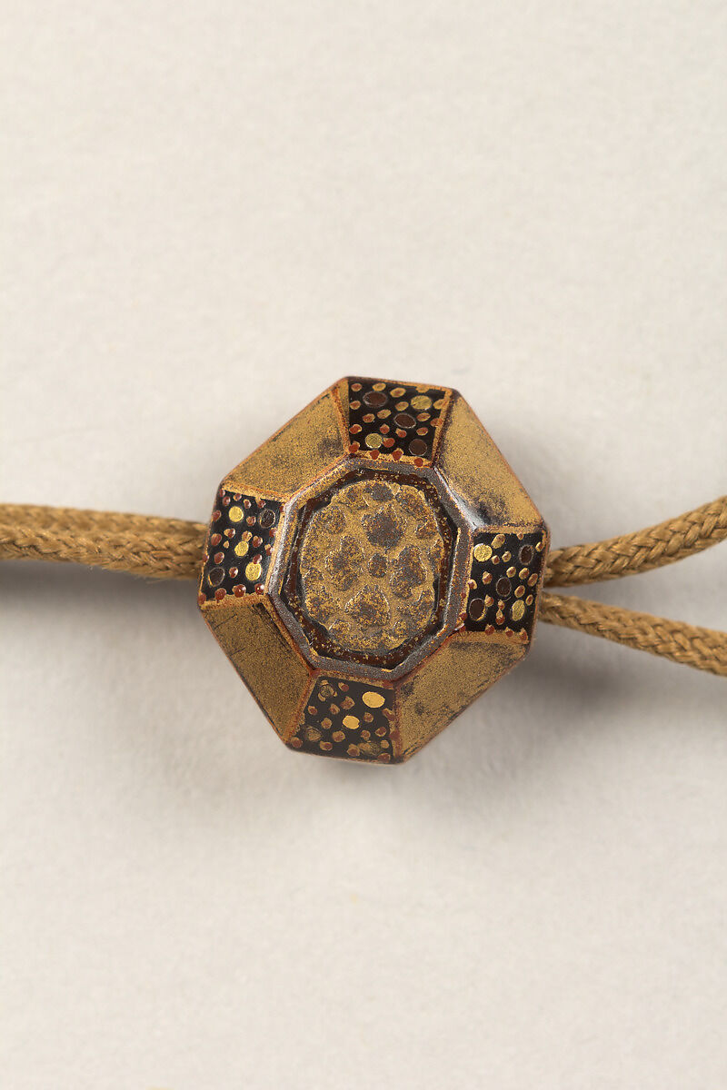 Inrō with Scattered Musical Instruments, Theatrical Implements, and Flowers, Shibata Zeshin (Japanese, 1807–1891), Four cases; lacquered wood with gold, silver hiramaki-e, mother-of-pearl inlay, and cut-out gold foil application on black ground
Netsuke: bucket with grasses and flowers; lacquer with gold hiramaki-e
Ojime: flowers; lacquer bead, Japan