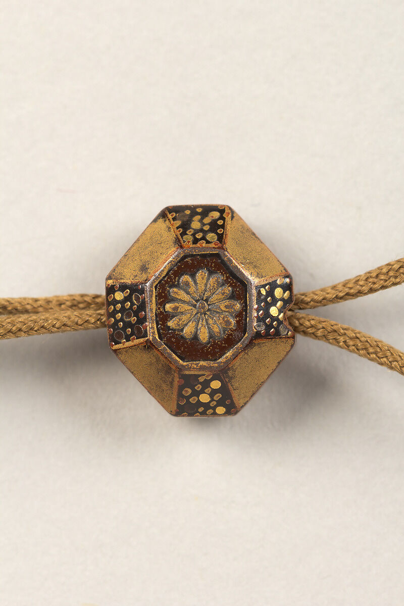 Inrō with Scattered Musical Instruments, Theatrical Implements, and Flowers, Shibata Zeshin (Japanese, 1807–1891), Four cases; lacquered wood with gold, silver hiramaki-e, mother-of-pearl inlay, and cut-out gold foil application on black ground
Netsuke: bucket with grasses and flowers; lacquer with gold hiramaki-e
Ojime: flowers; lacquer bead, Japan